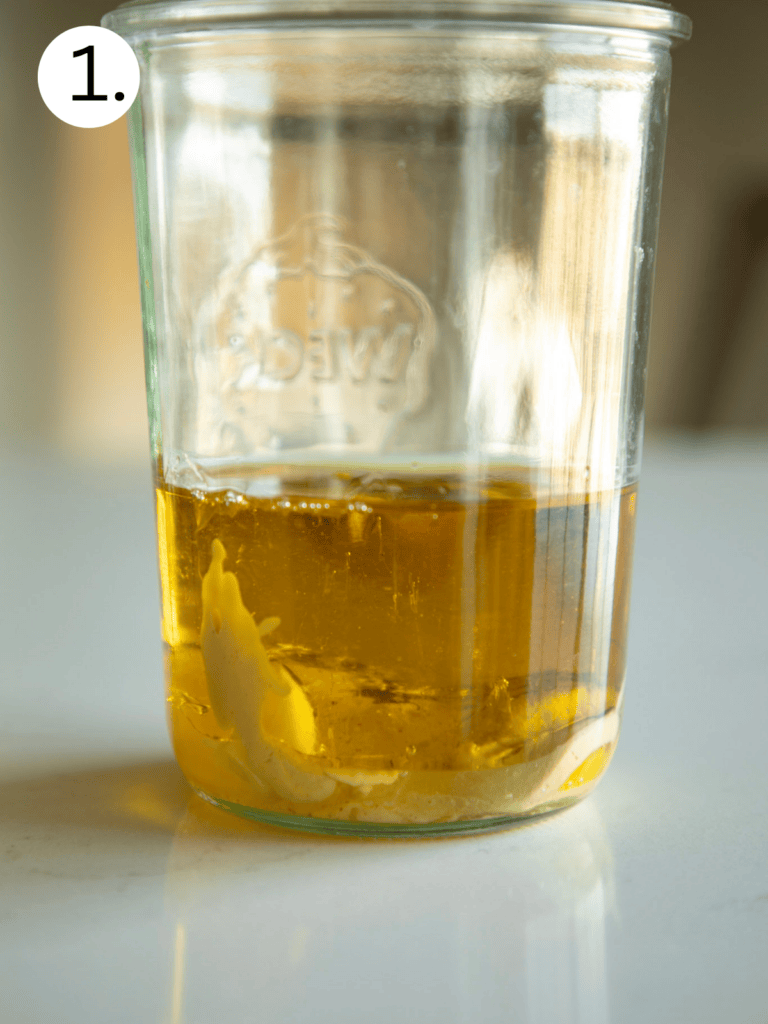 olive oil and garlic in a glass jar