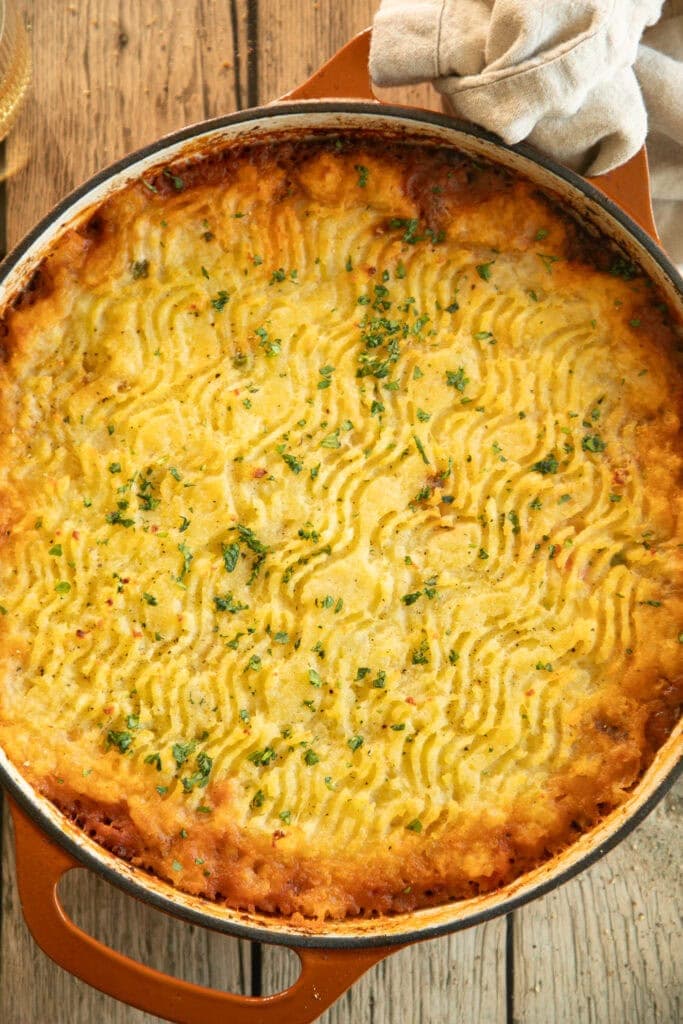 big casserole dish full of shepherds pie topped with mashed potatoes