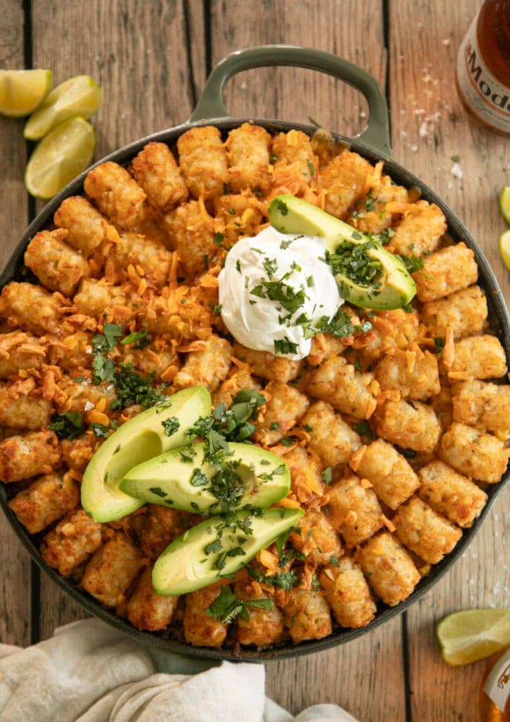 Golden brown tater tot casserole fresh out of the oven with toppings