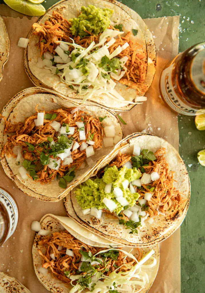 loaded corn tortillas with the shredded chicken and toppings