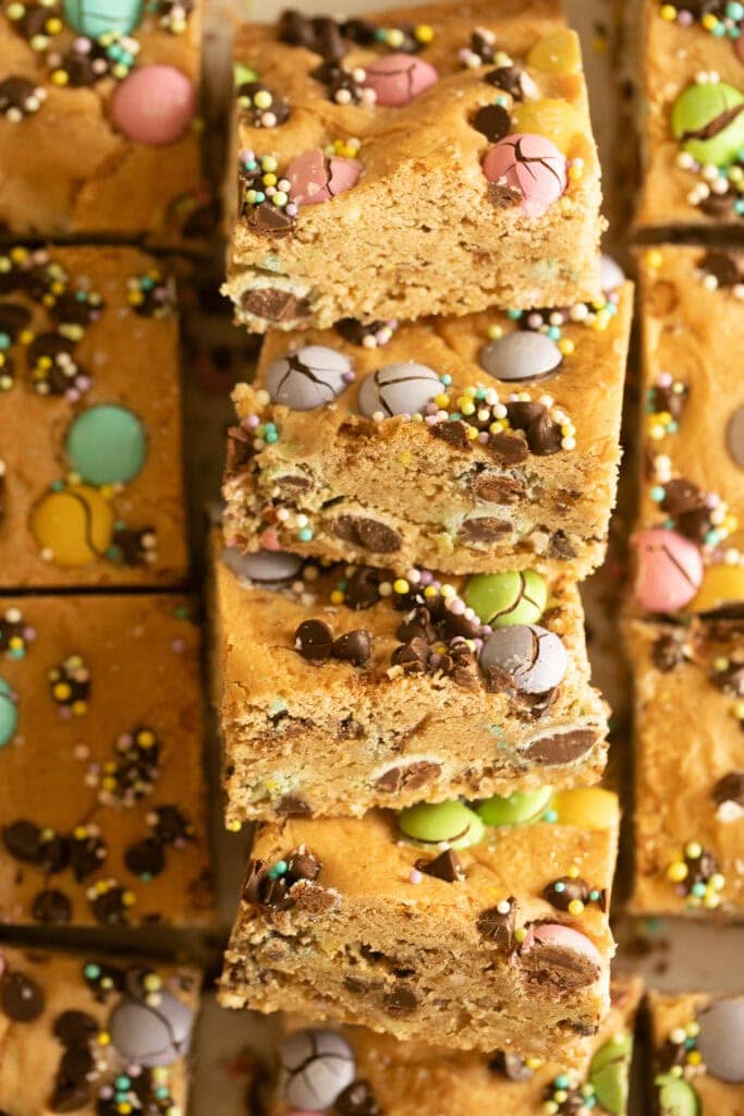 stacked Easter M&M cookie bars on parchment paper