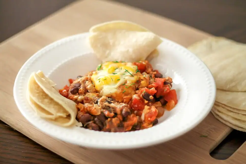 Bowl full of Mexican baked eggs 