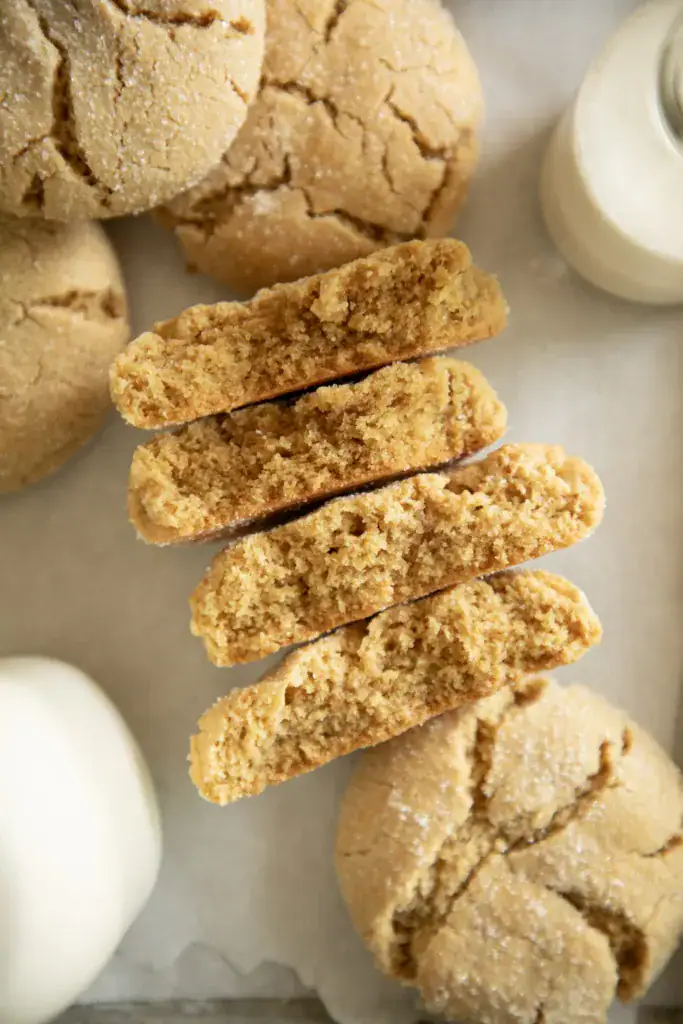 Split chewy peanut butter cookie showing moist, tender texture inside