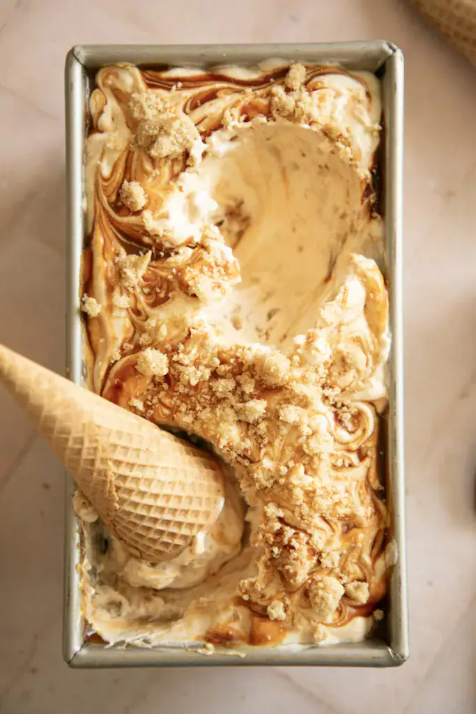 metal loaf pan full of snickerdoodle and salted caramel ice cream 