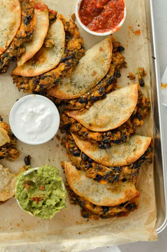 baked tacos on parchment paper
