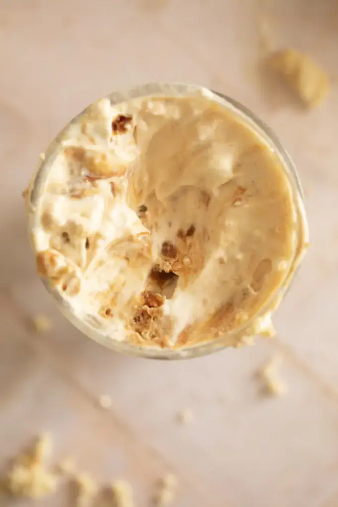 glass full of ice cream with caramel swirl