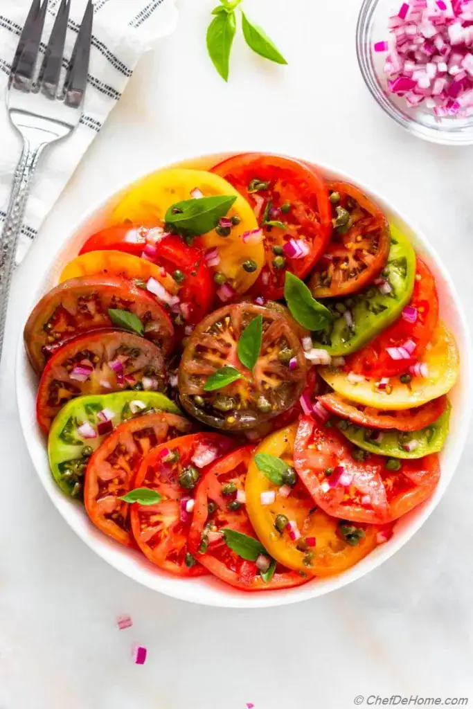 Plate full of tomato slices 