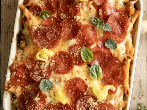 Pepperoni pizza pasta casserole with a golden cheesy top and crisp edges