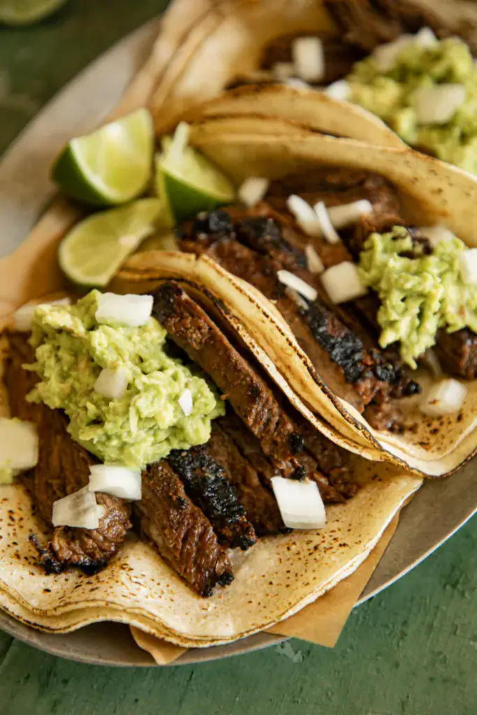 sliced skirt steak on tortillas