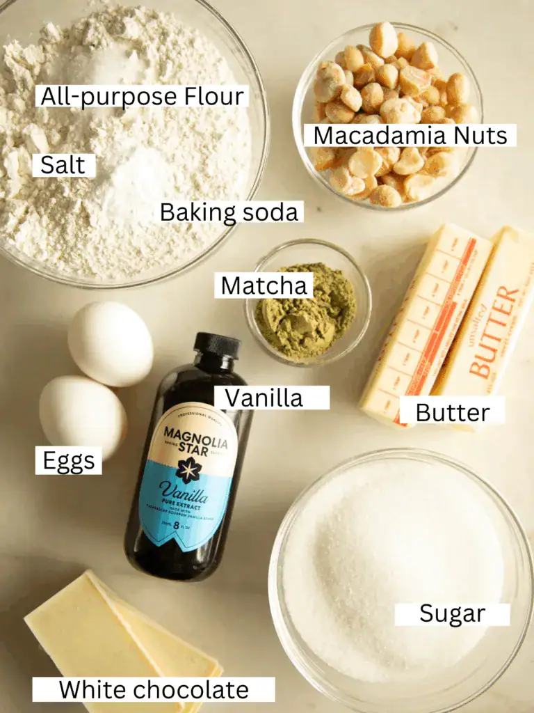 labeled and portioned ingredients on a marble slab for the matcha cookies