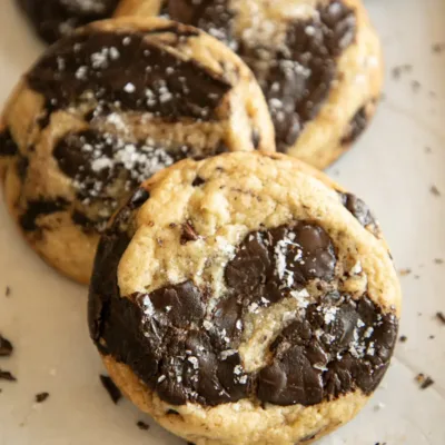 Stacked chocolate chunk cookies with crisp edges and gooey centers.