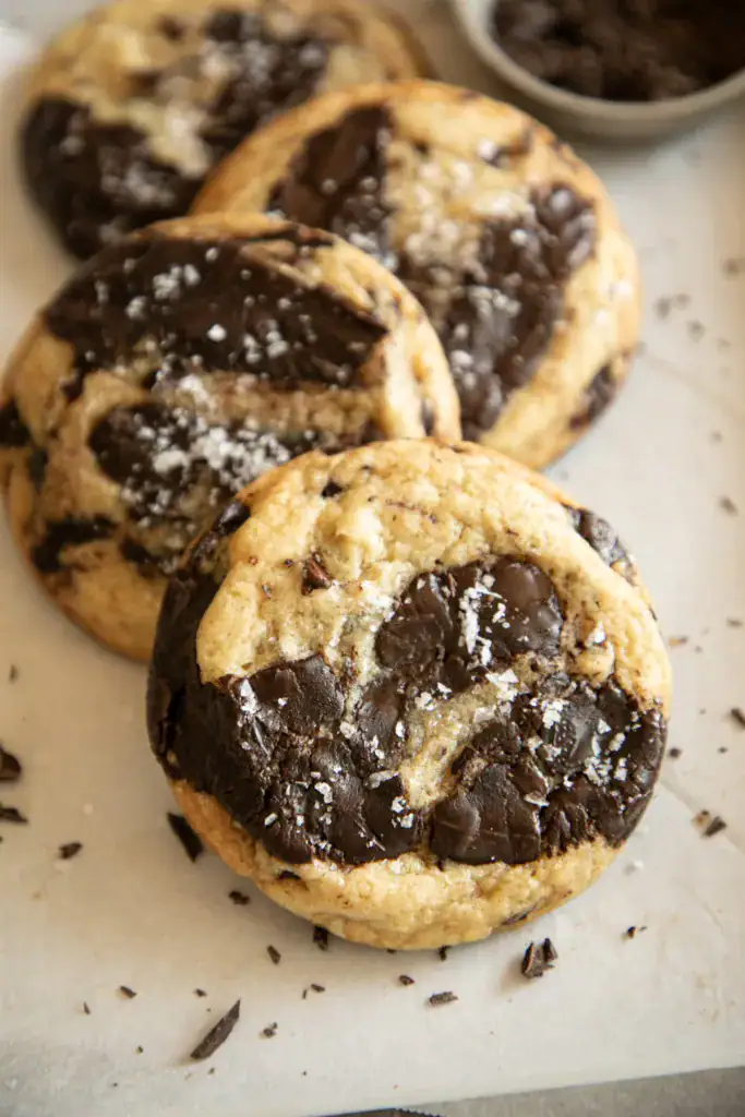 Stacked chocolate chunk cookies with crisp edges and gooey centers.