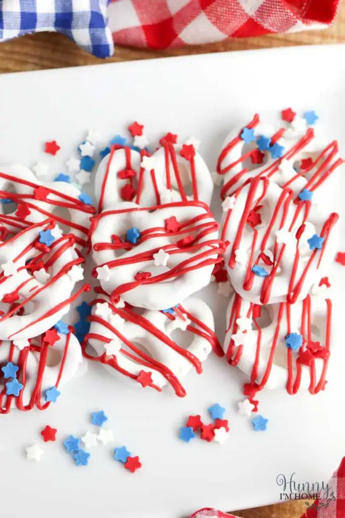 pretzels dipped in white chocolate with sprinkles