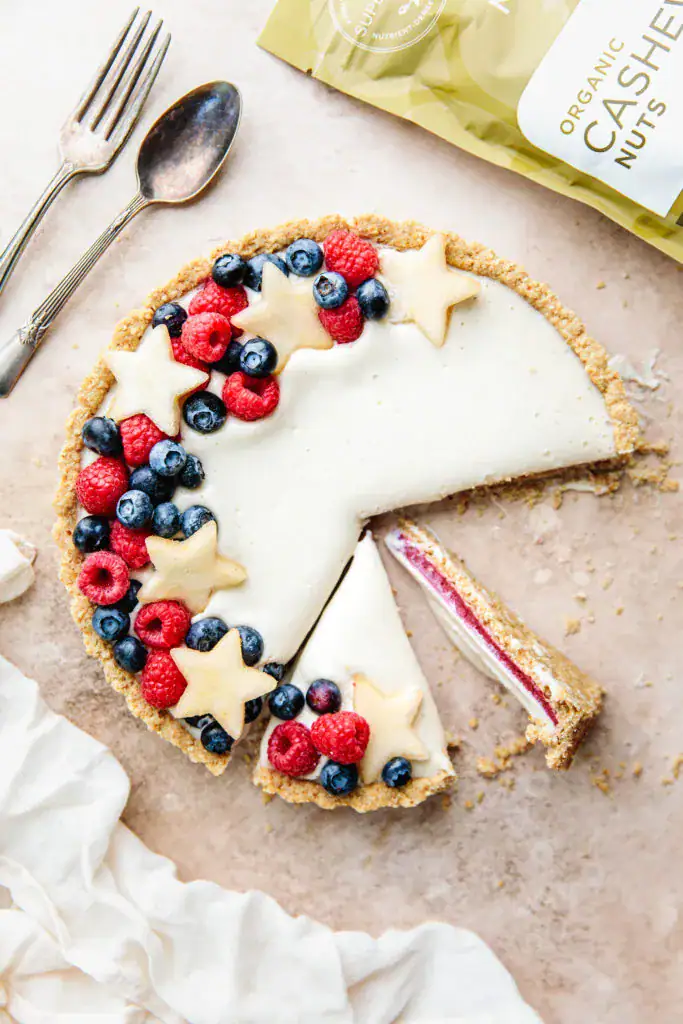 cheesecake tart with red white and blue fruit slices