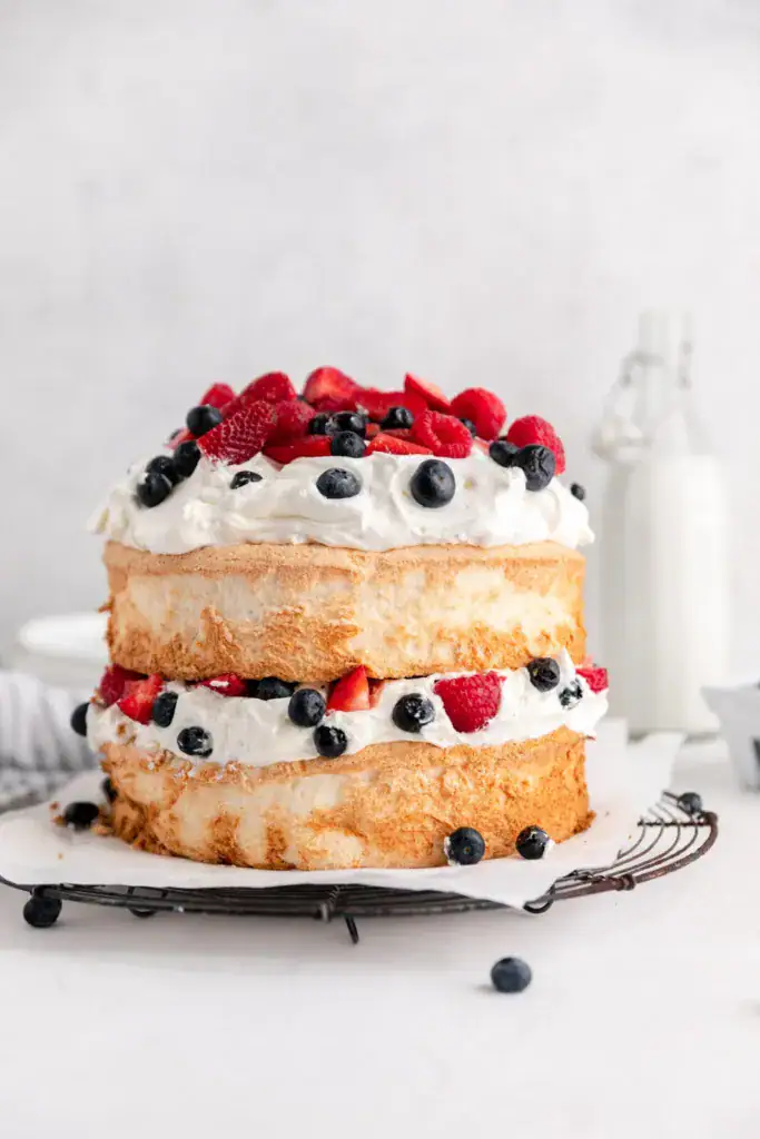 Layered angel food cake with berries and whipped cream