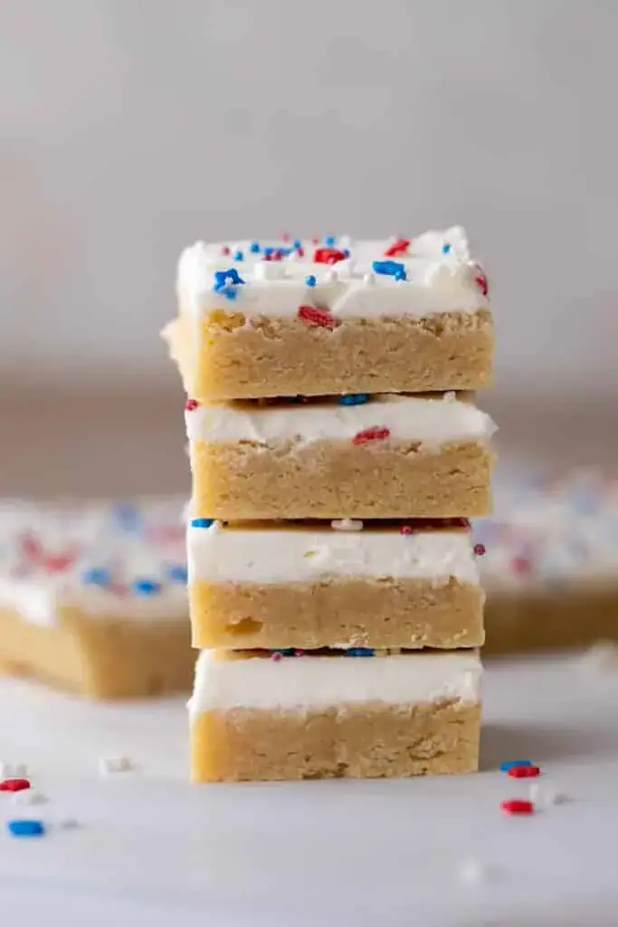 Stacked sugar cookie bars with sprinkles