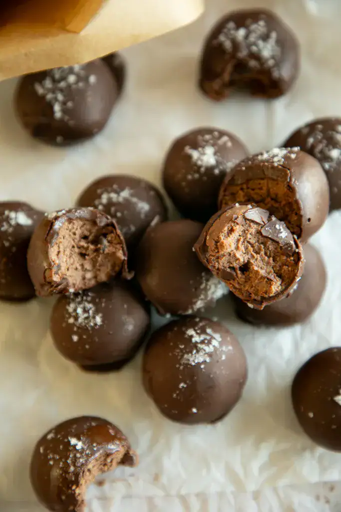 Protein bites on a neutral surface with scattered ingredients