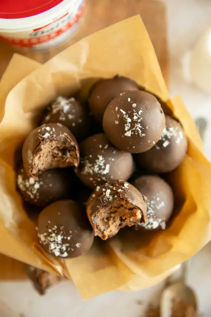 Final hero image of no-bake brownie batter protein bites ready to serve