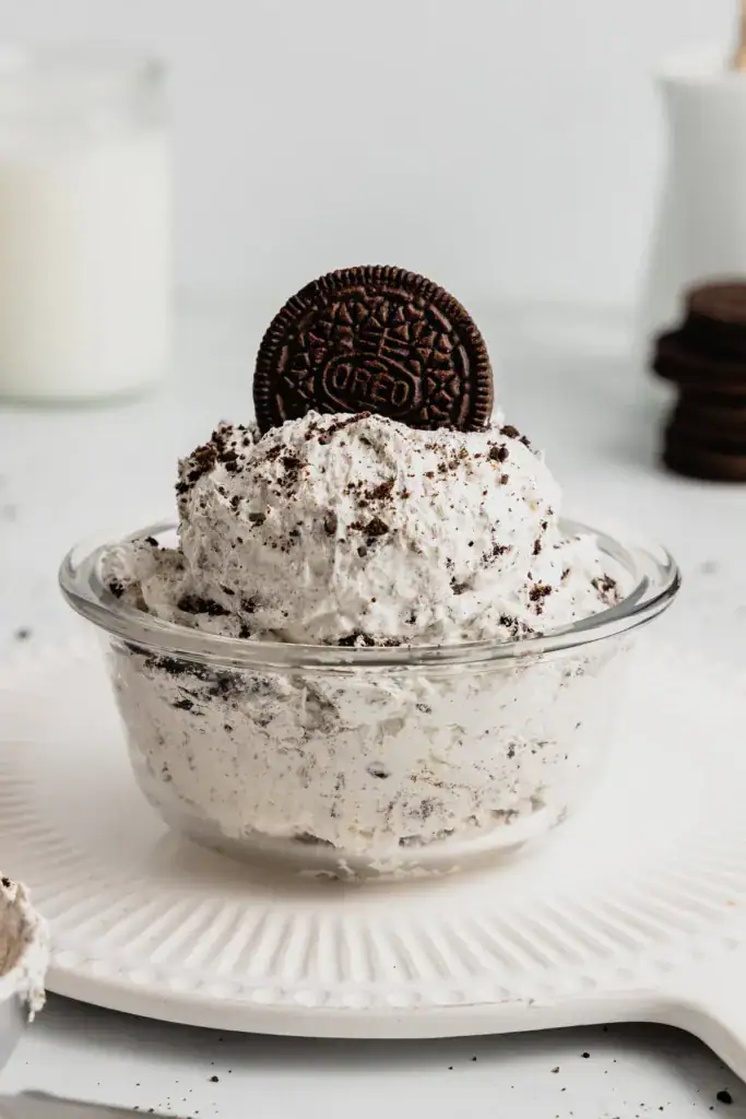 glass bowl of Oreo fluff with an Oreo cookie