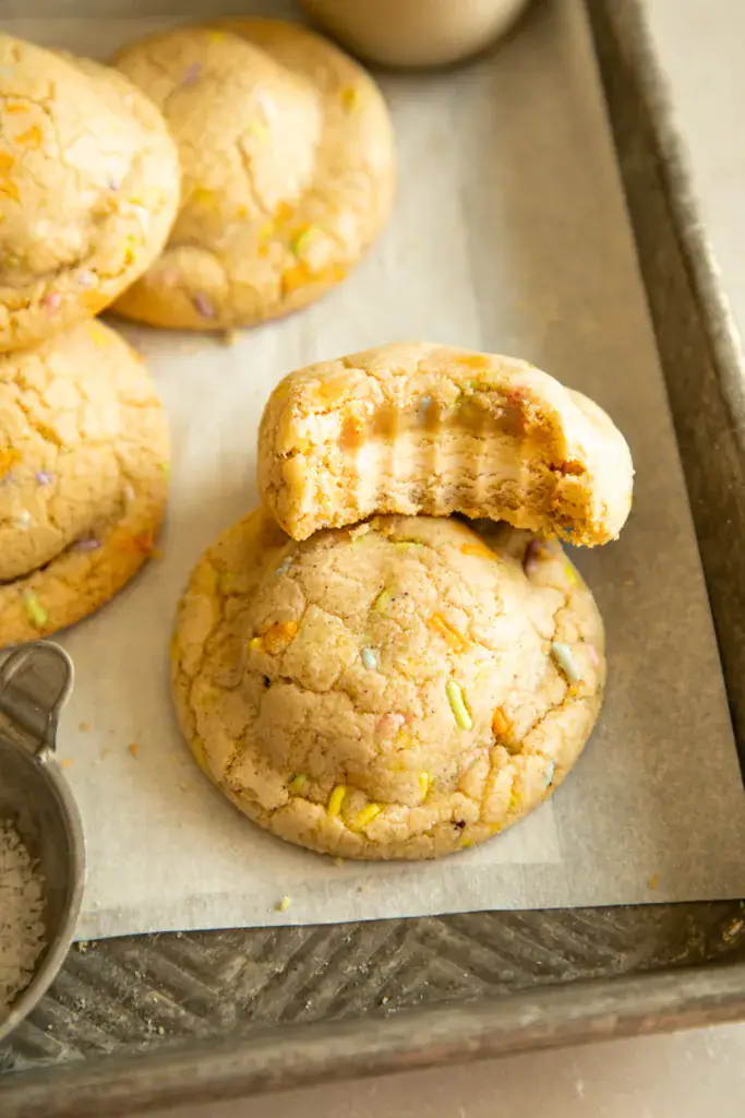 Soft and chewy brown butter funfetti cookie with a bite taken out, showing Oreo center