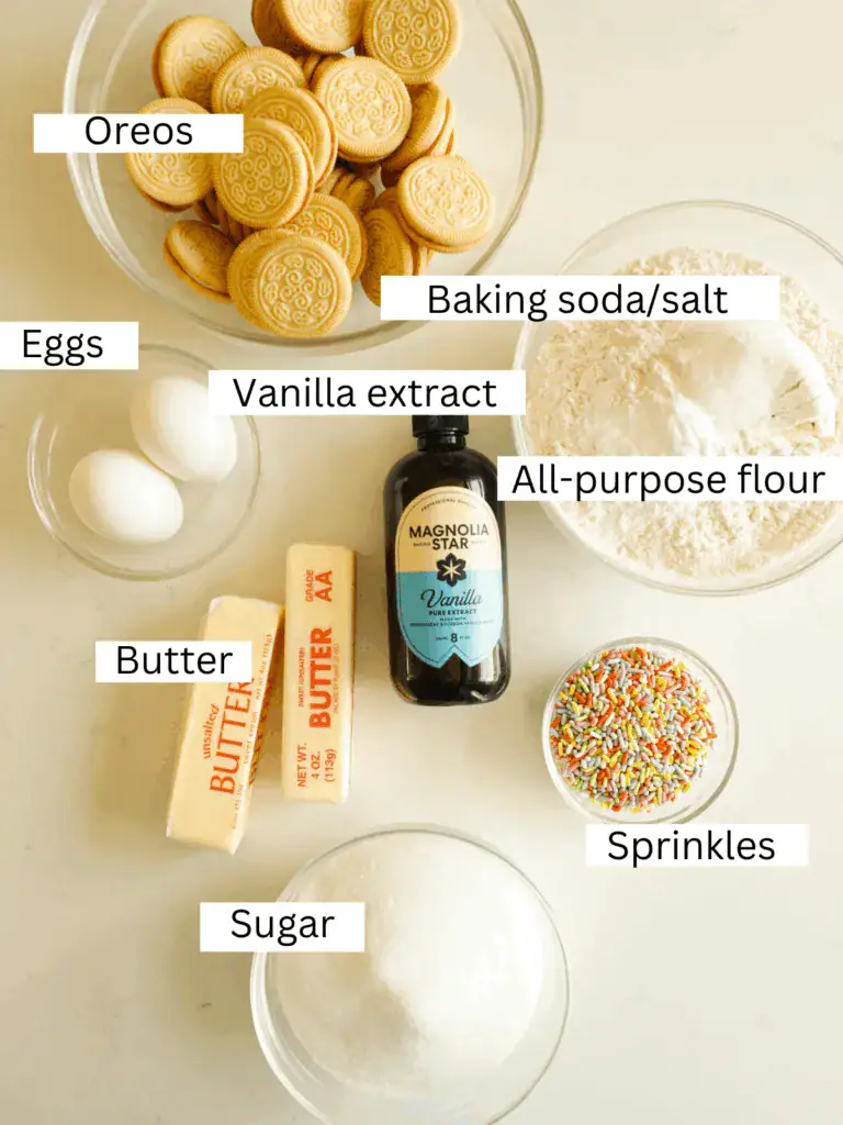 Overhead view of ingredients for brown butter funfetti cookies including Golden Oreos, butter, flour, eggs, and sprinkles