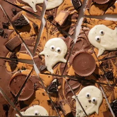Melting white chocolate chips with coconut oil for making ghost shapes on the bark