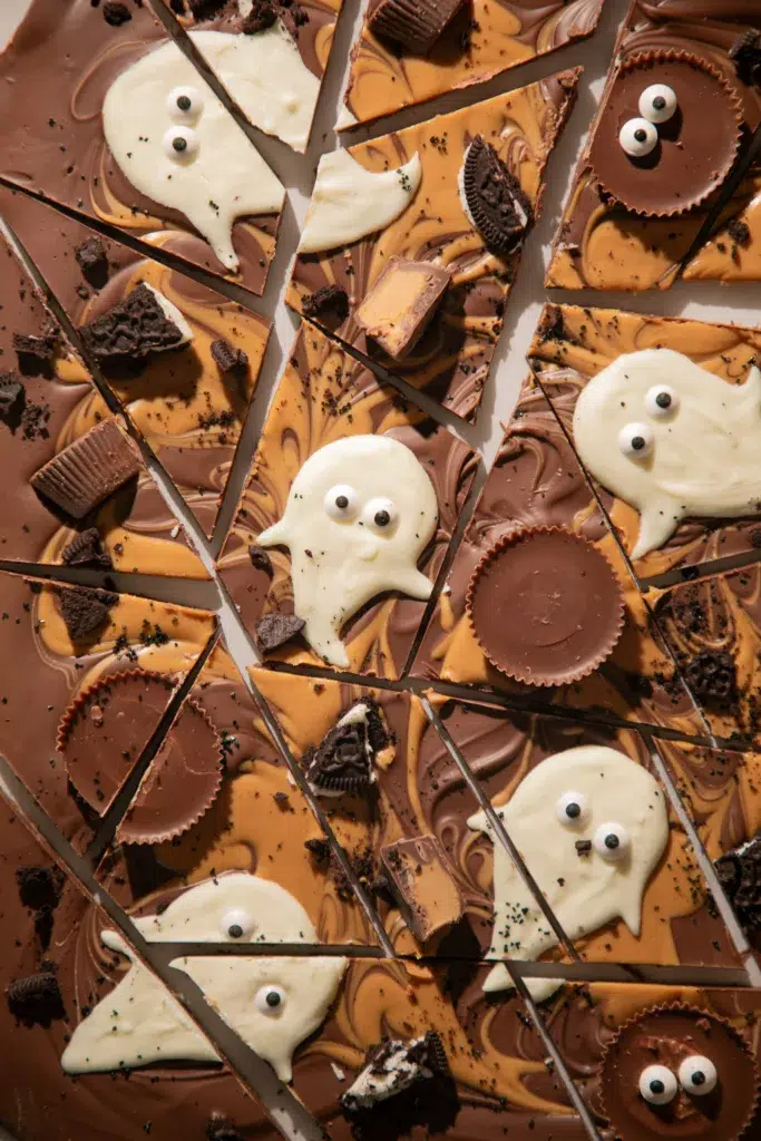 Melting white chocolate chips with coconut oil for making ghost shapes on the bark