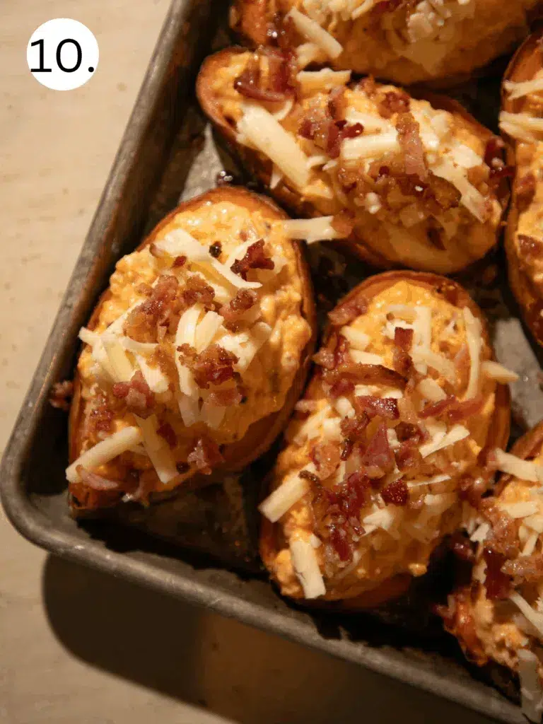 Twice baked sweet potatoes topped with shredded cheddar and bacon before baking.