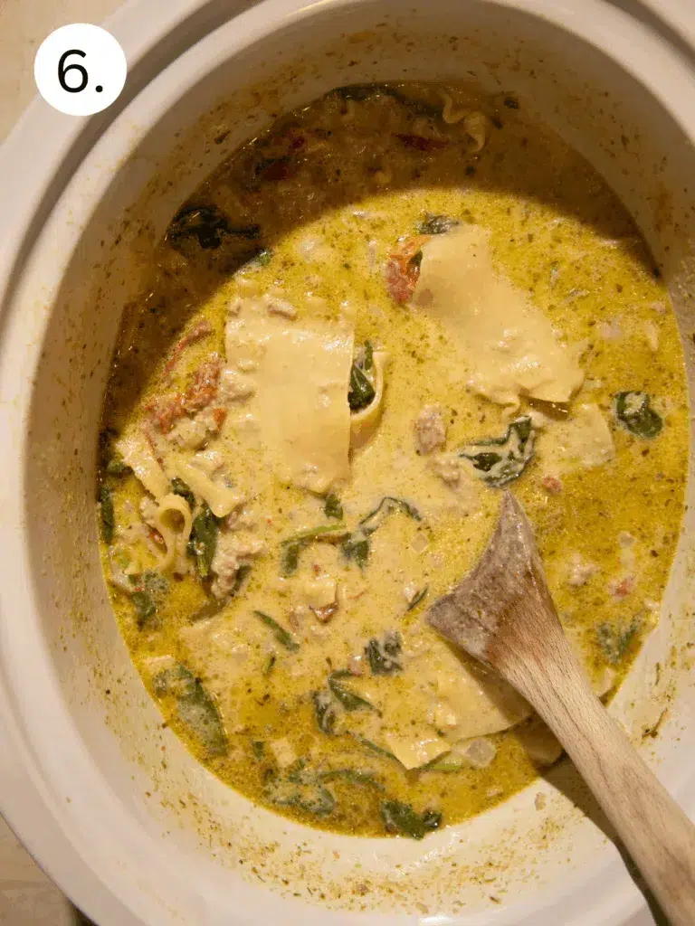 Creamy slow cooker white lasagna soup with spinach, turkey, and noodles.
