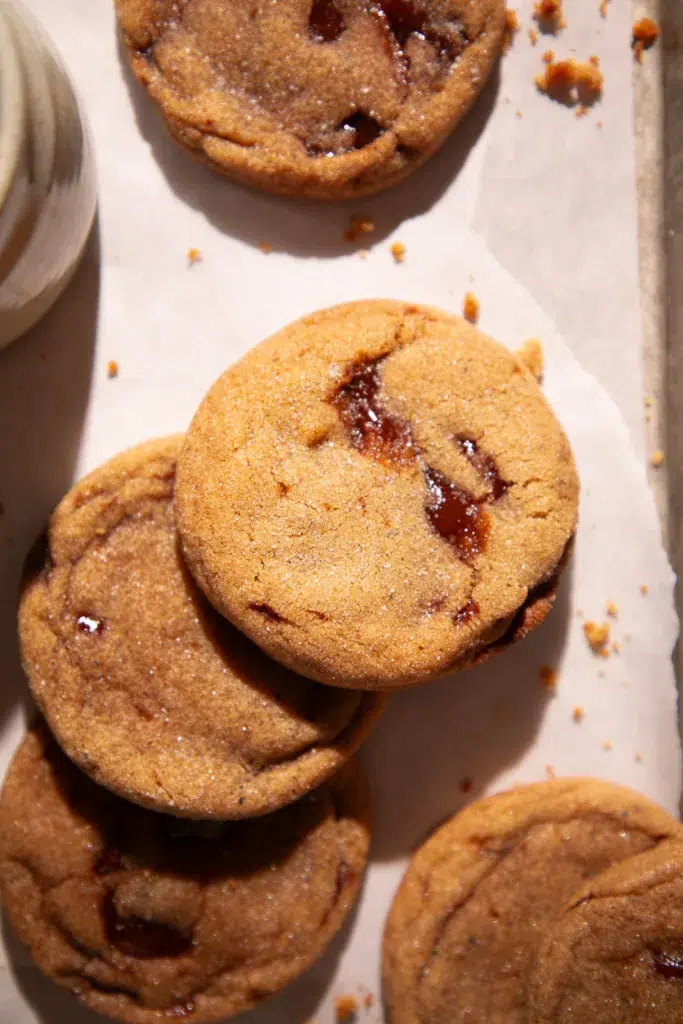 Close-up of chewy brown sugar cookies with toffee chunks.