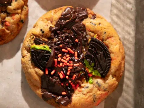 Freshly baked Halloween chocolate chip cookies loaded with Oreos, Reese’s, chocolate chunks, and sprinkles.