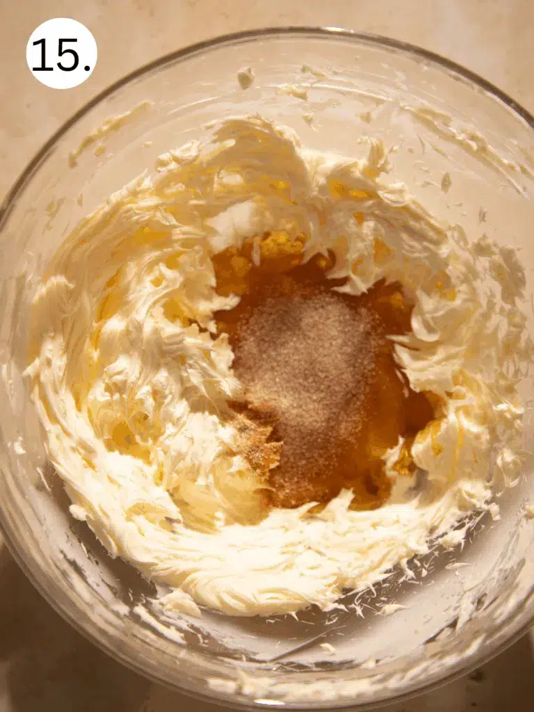 Whipped butter with maple syrup and cinnamon sugar in a mixing bowl before blending.