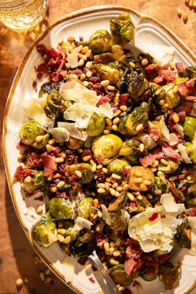 Holiday platter with crispy Brussels and bacon served with glasses of wine