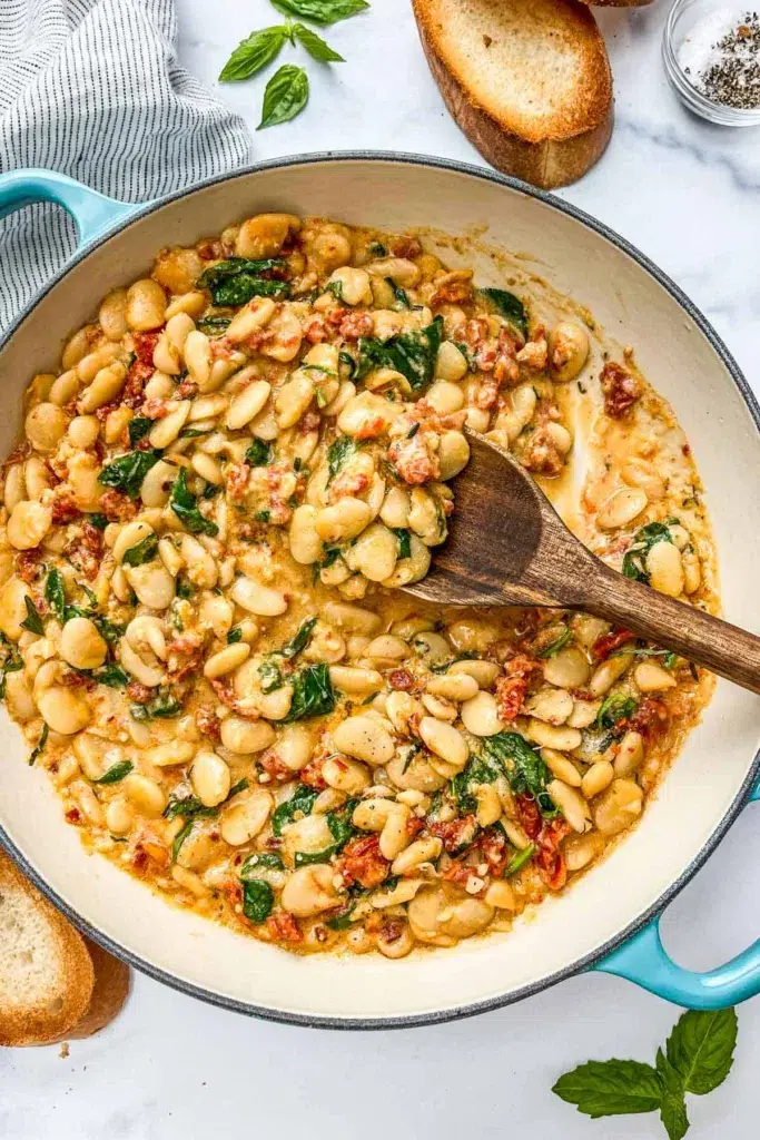 large skillet with butter beans