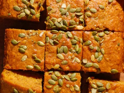 Slices of maple banana bread topped with pepitas
