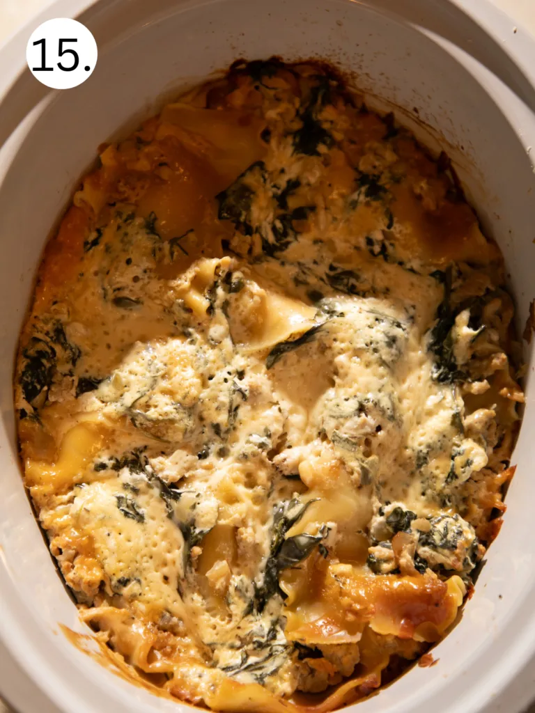 Finished slow cooker white chicken lasagna cooked until creamy and set.