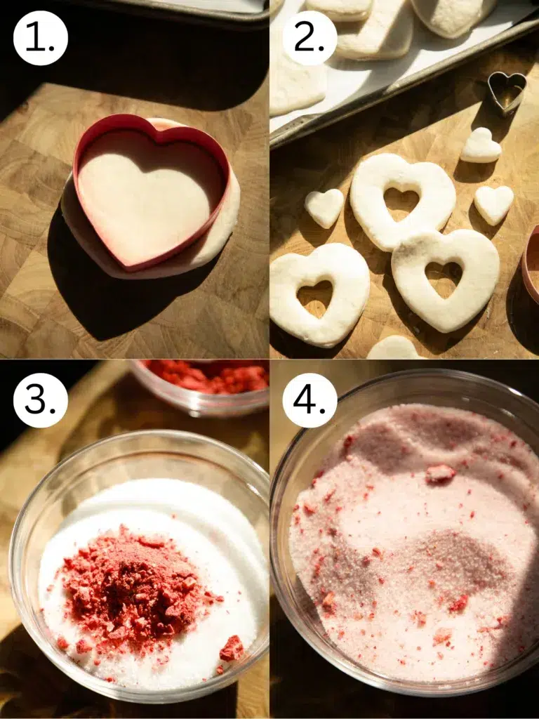 Step-by-step collage showing biscuit dough cut into heart shapes, uncooked donut shapes on a cutting board, crushed freeze-dried strawberries mixed with sugar, and finished strawberry sugar coating.